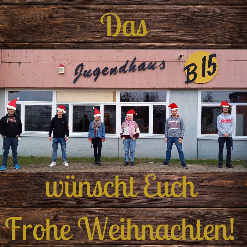 Das Jugendhaus-Team vor dem Jugendhaus mit Nikolausmützen. Der Text ist Das Jugendhaus wünscht euch Frohe Weihnachten
